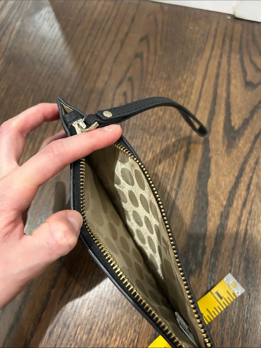 kate spade black and gold wristlet pouch
